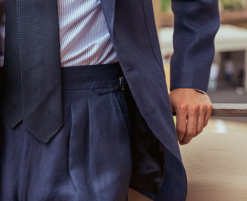 Double pleats and a wide waistband trousers from a navy blue linen suit