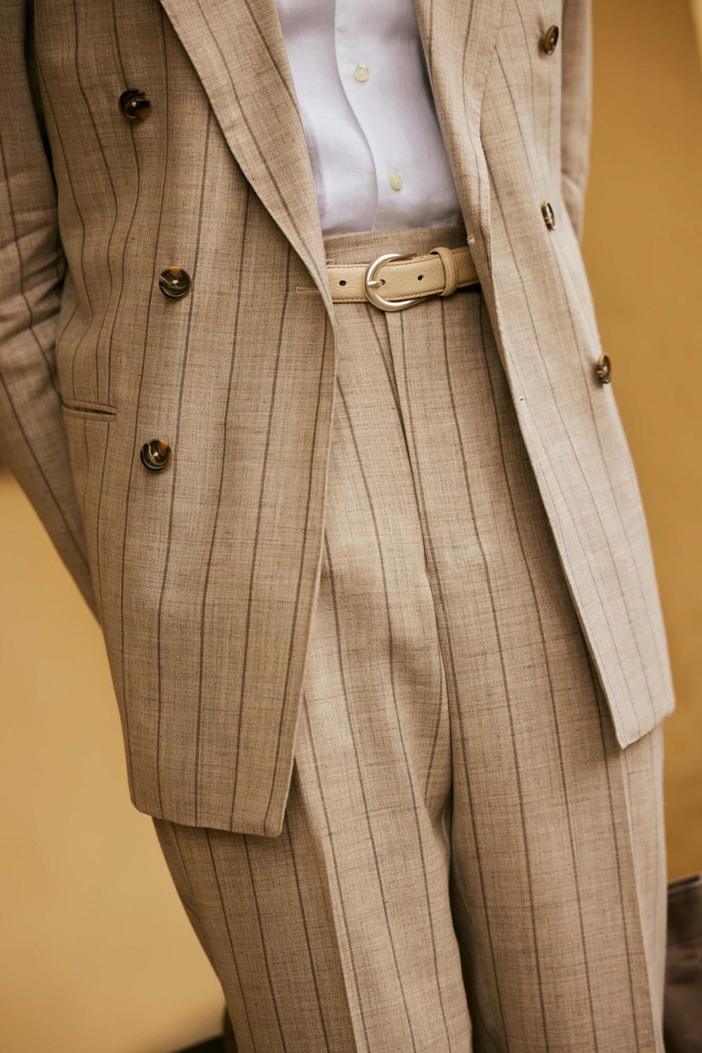 carlos domord at pitti uomo wearing a custom made taupe beige striped suit