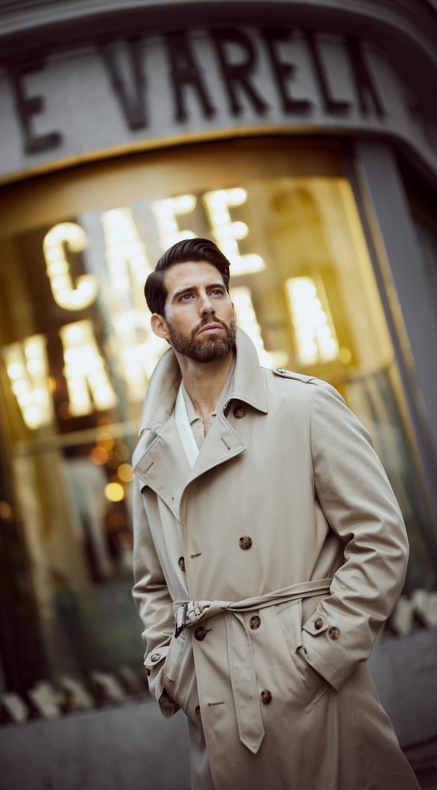 carlos domord in a custom made mond beige trench coat