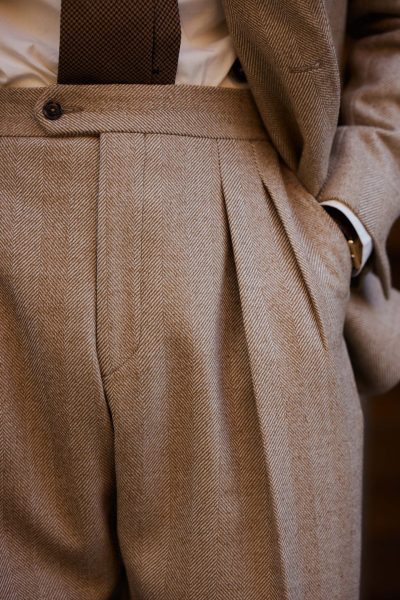 Carlos domord at pitti uomo wearing a custom made herringbone coat and a matching suit