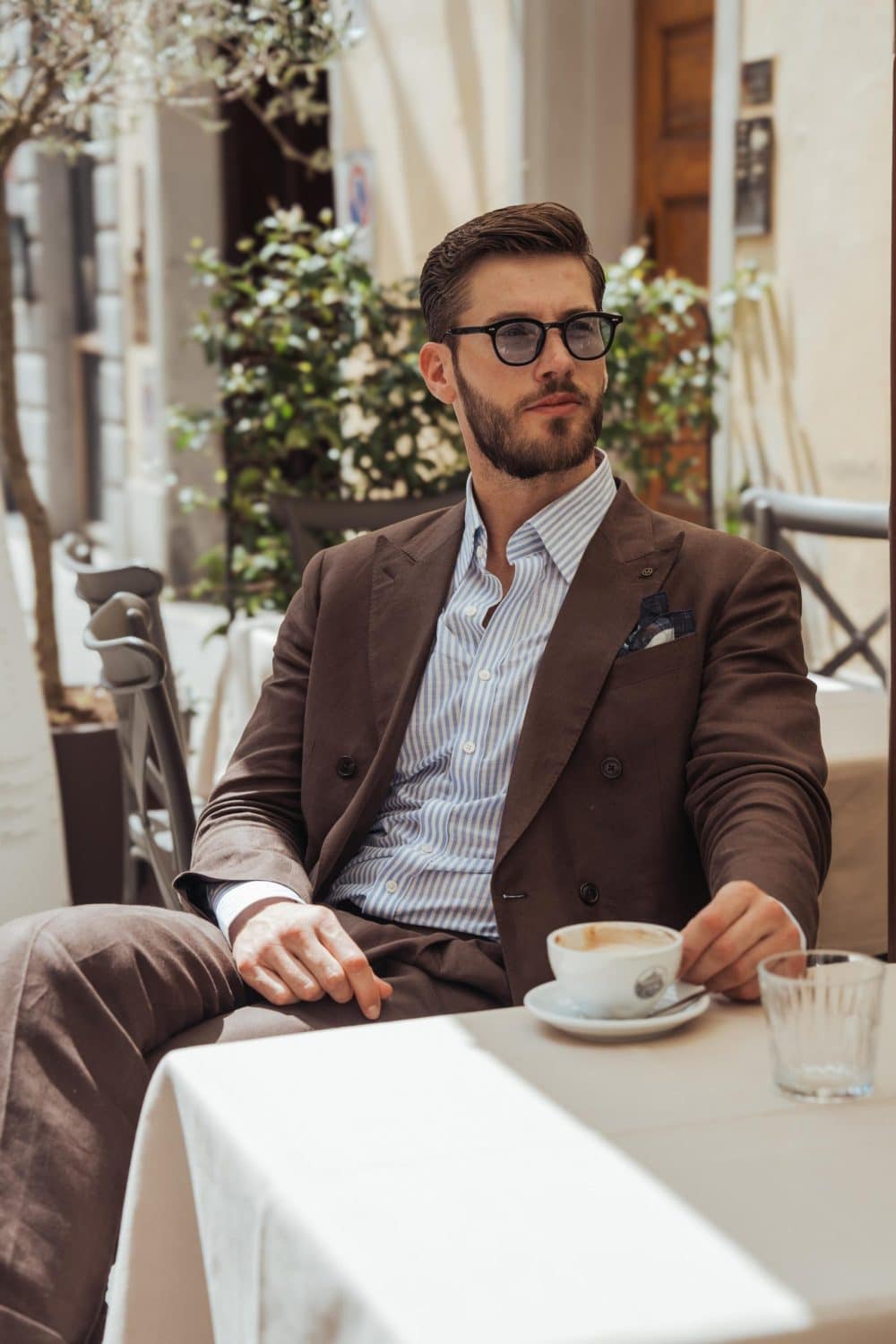 Burki at pitti uomo wearing a brown linen suit made by mond of copenhagen