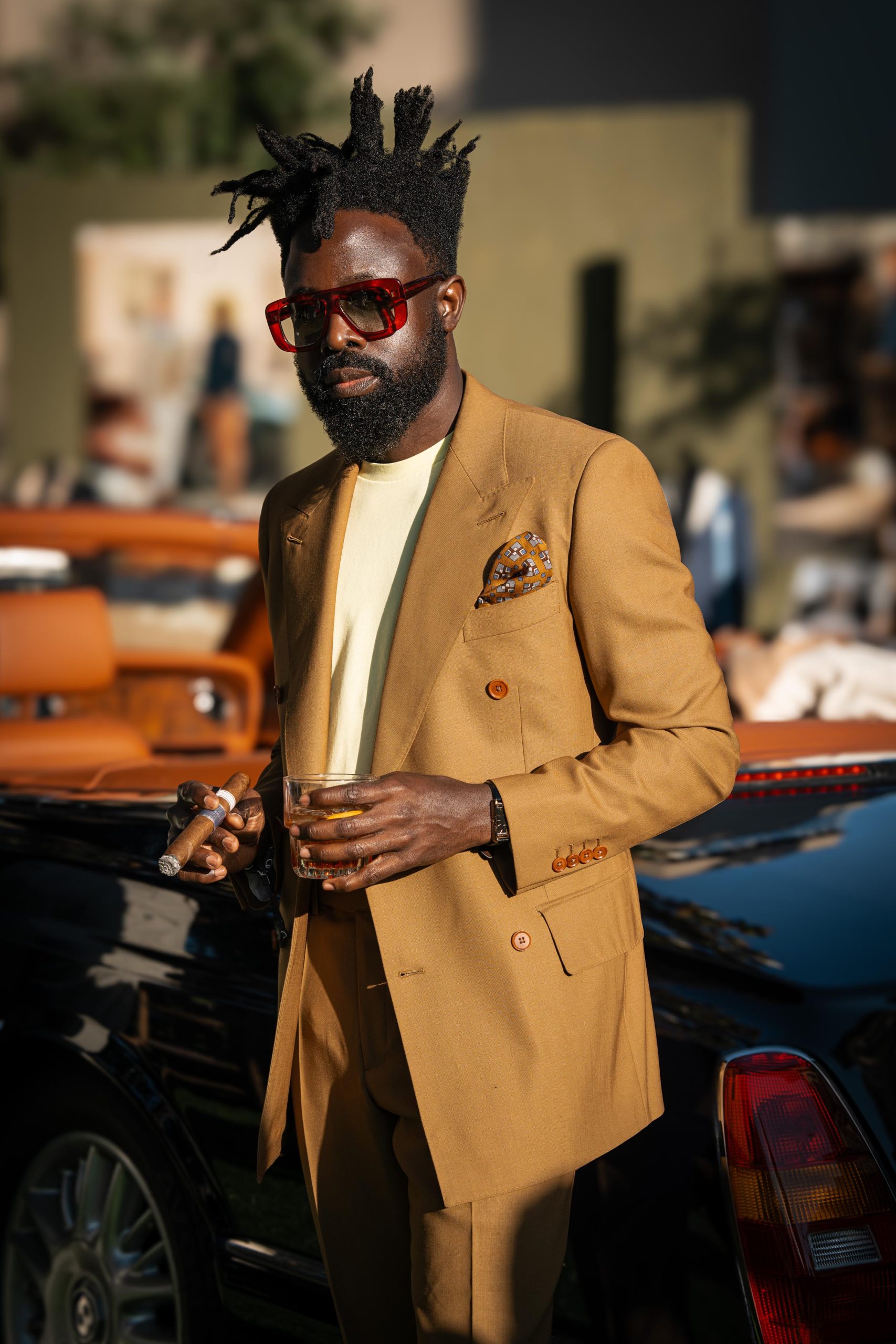 gentleman wearing a bright orange jacket during pitti uomo alexander kraft tailgating party