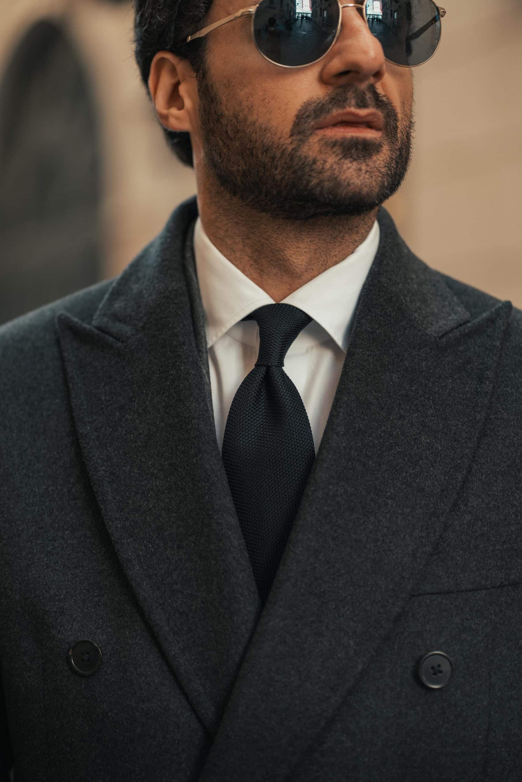 Giorgio giangiulio wearing a custom mond chalkstripe grey suit and a grey overcoat