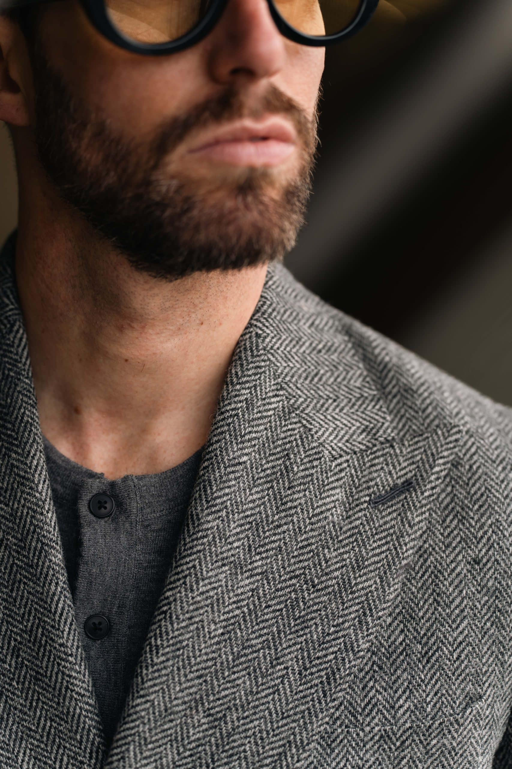 The charcoal herringbone suit with a matching overcoat, custom made by mond of copenhagen, worn by carlos domord at pitti uomo
