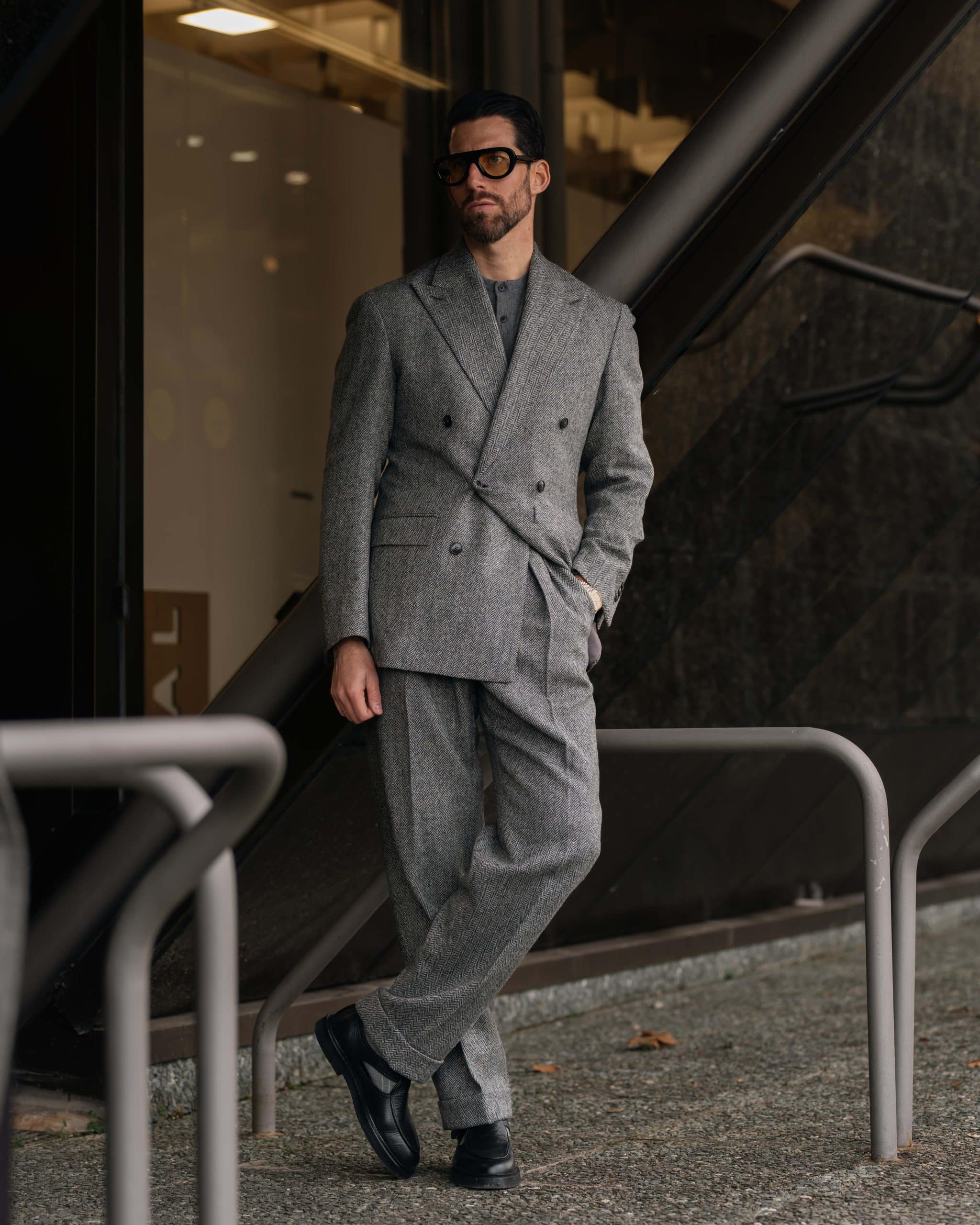 The charcoal herringbone suit with a matching overcoat, custom made by mond of copenhagen, worn by carlos domord