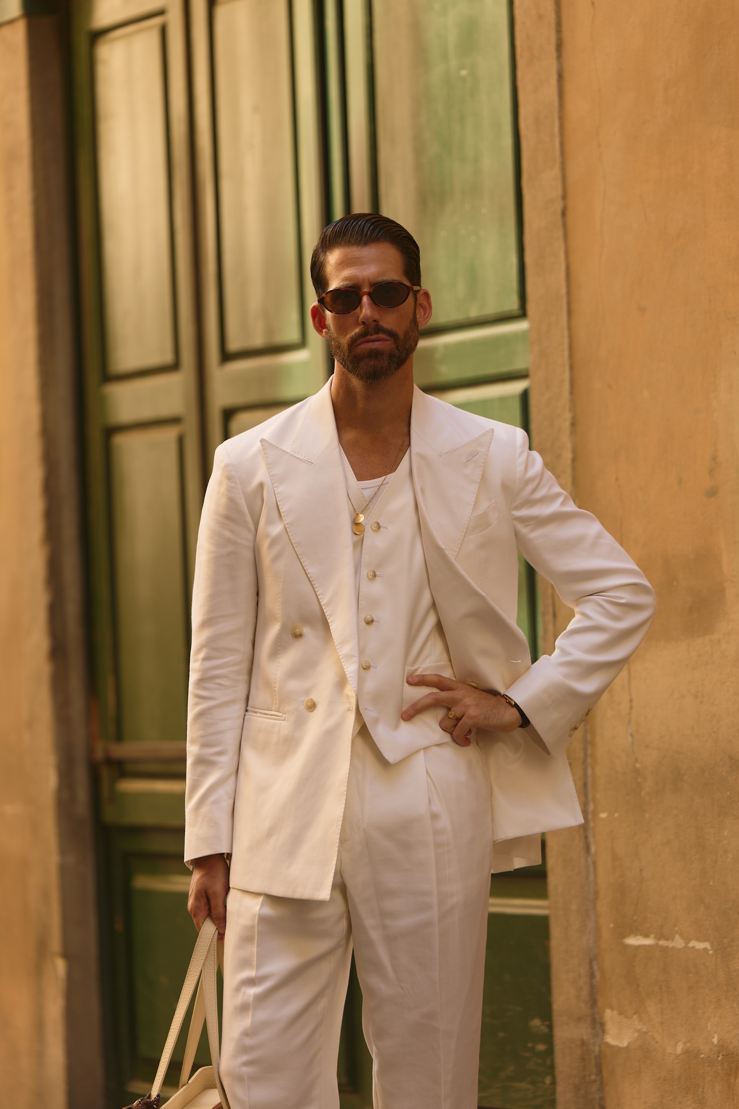 Carlos domord at pitti uomo, wearing a three piece off-white silk, wool and linen suit
