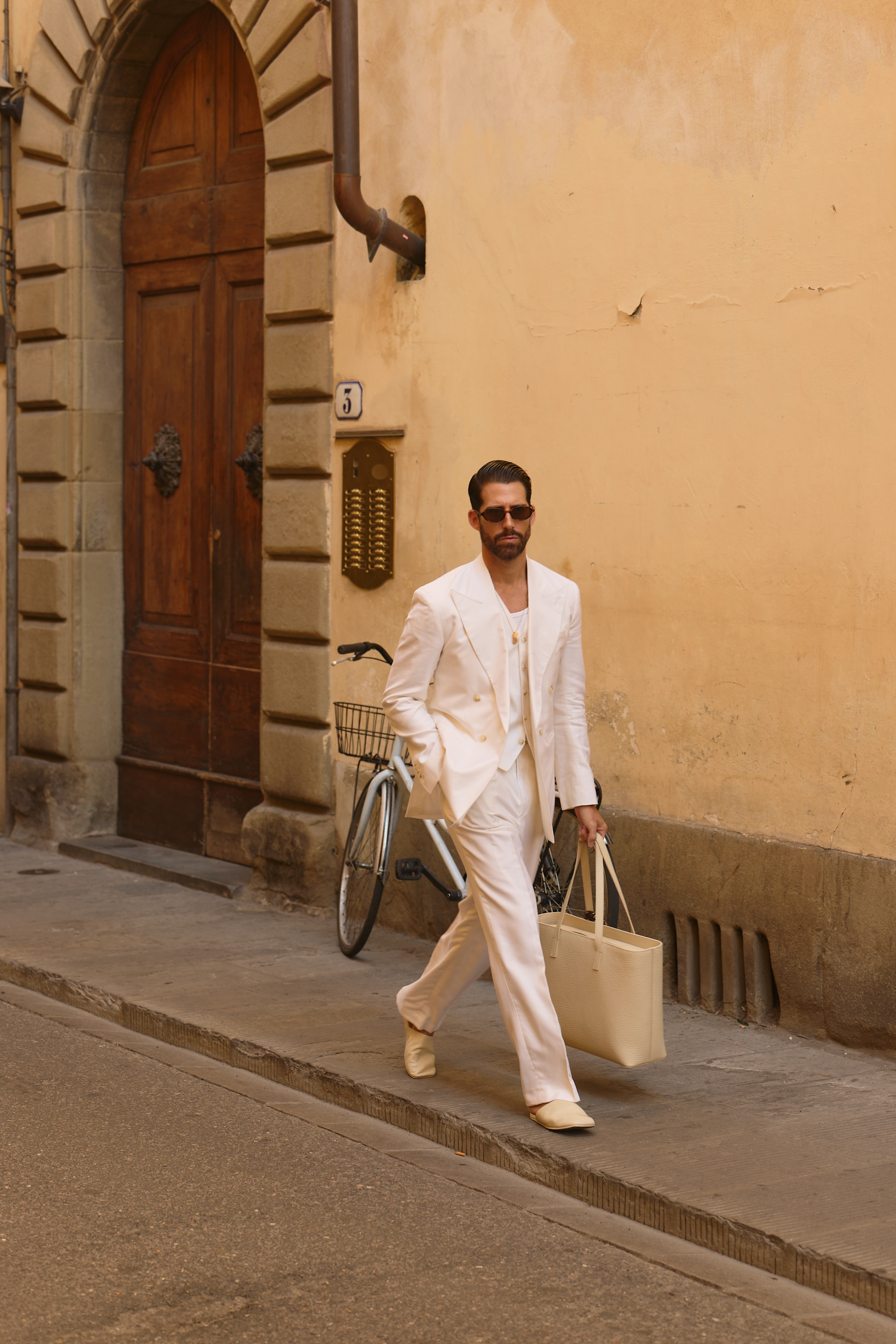 Custom made off-white suit by mond, worn by carlos domord at pitti uomo 110