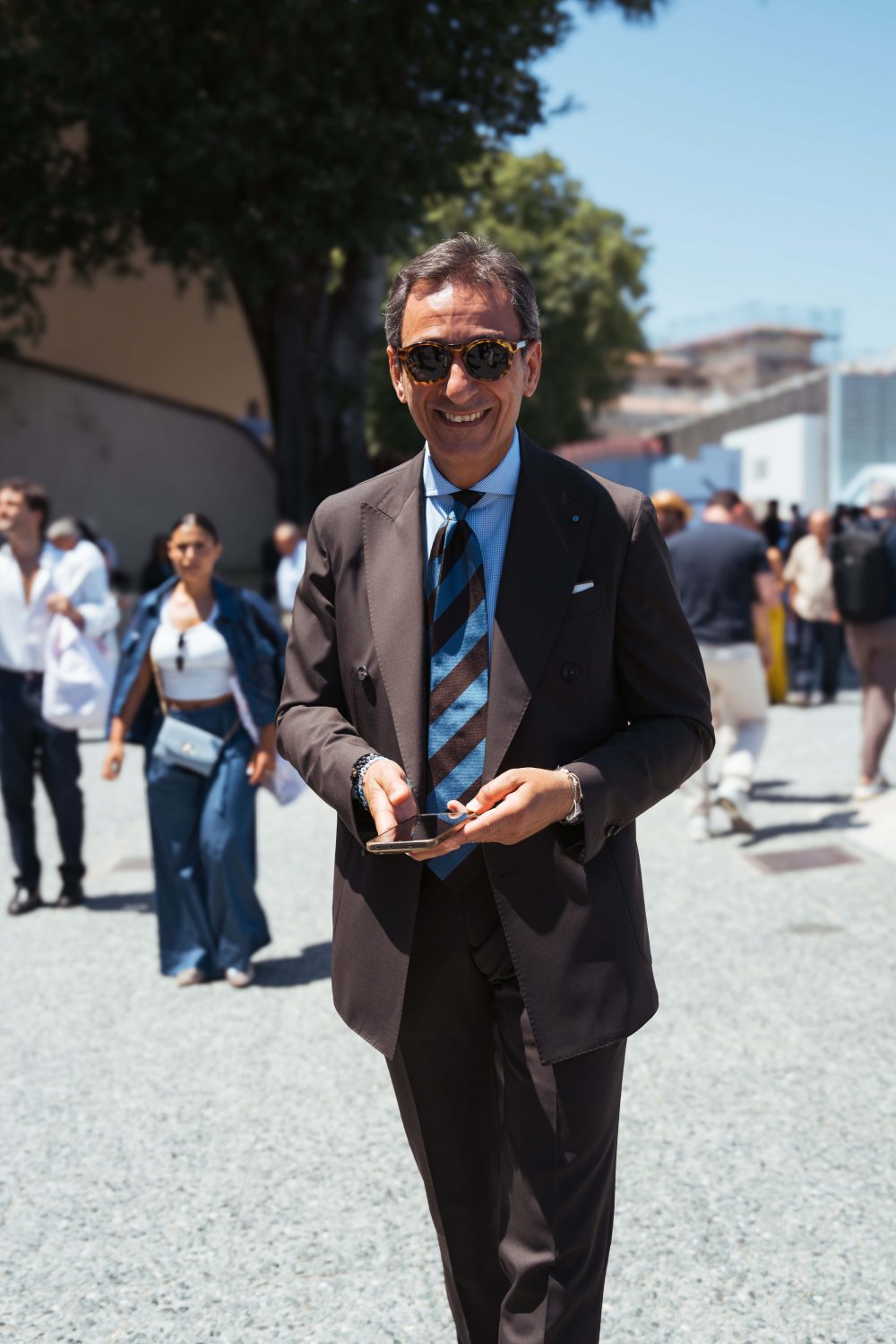 Gentleman wearing a brown suit at pitti uomo 110 shot by mond