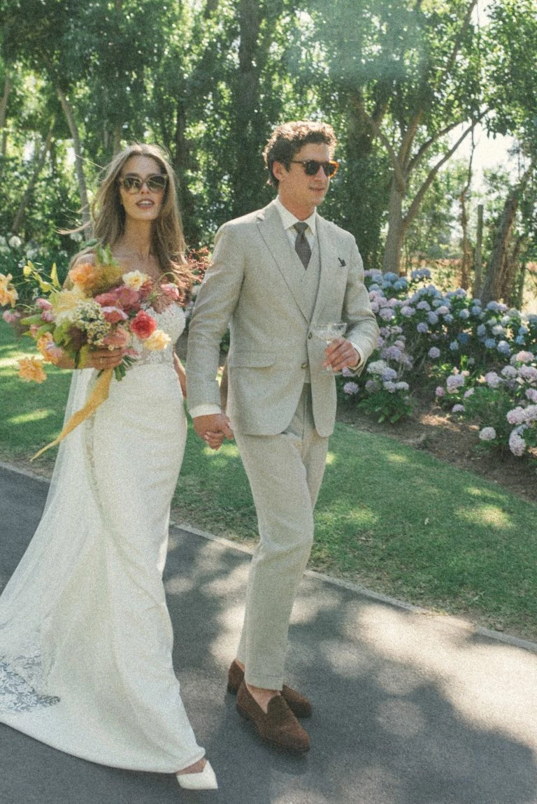 custom made beige wedding suit with Windsor tie knot