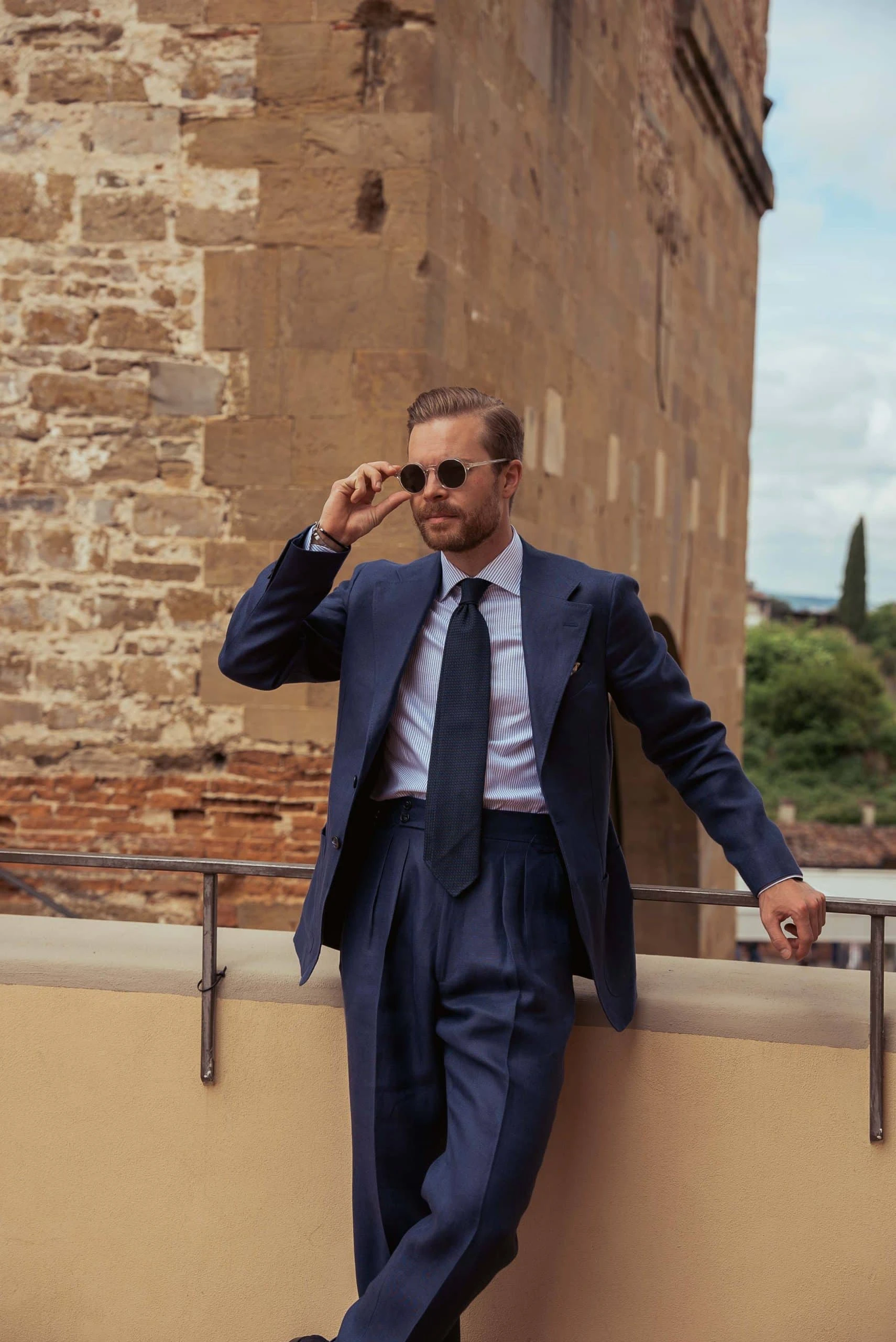 Johan Wikstrøm spotted wearing a navy blue linen suit at Pitti Uomo