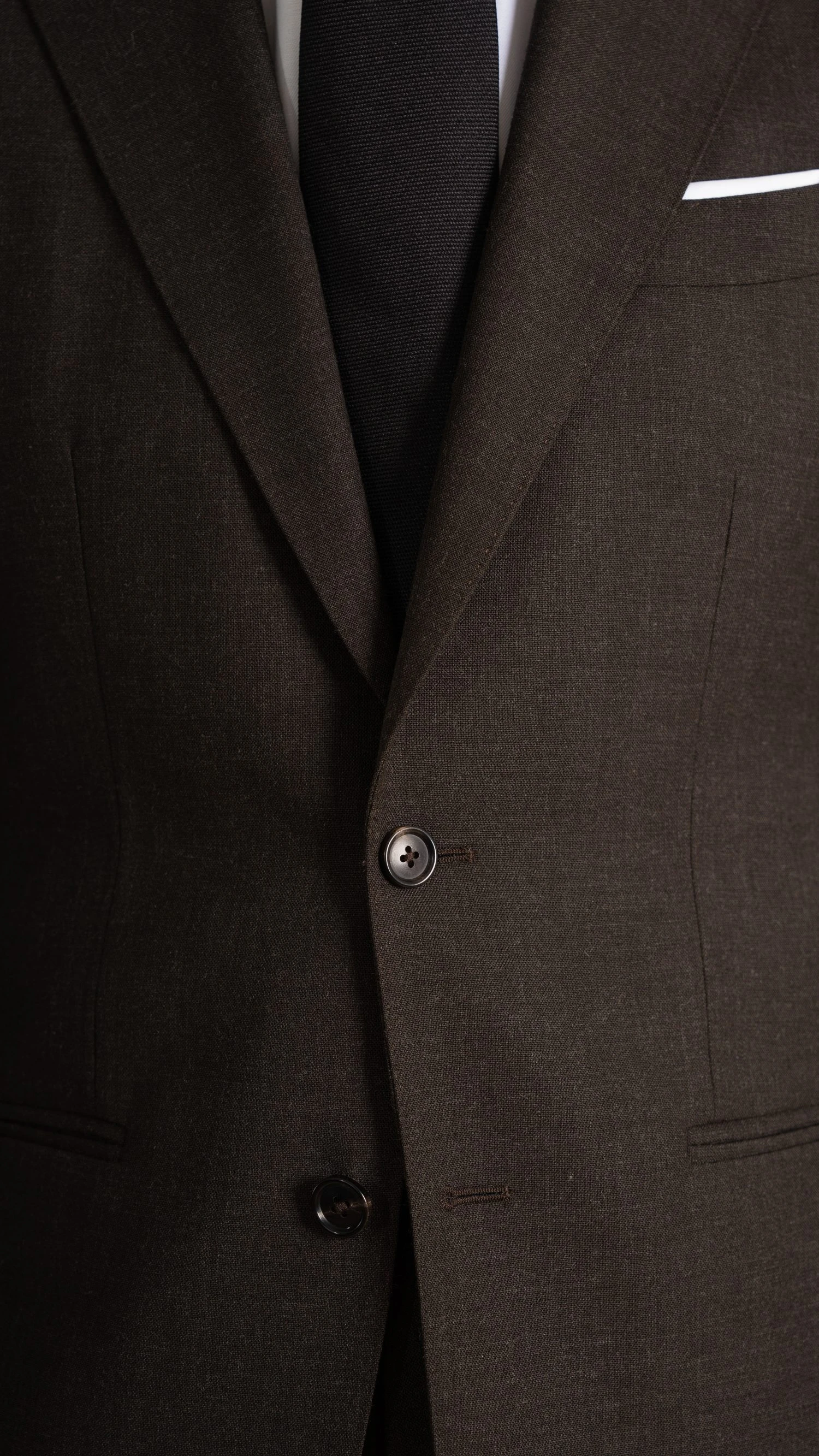 closeup of custom brown suit in twistair fabric, by Mond