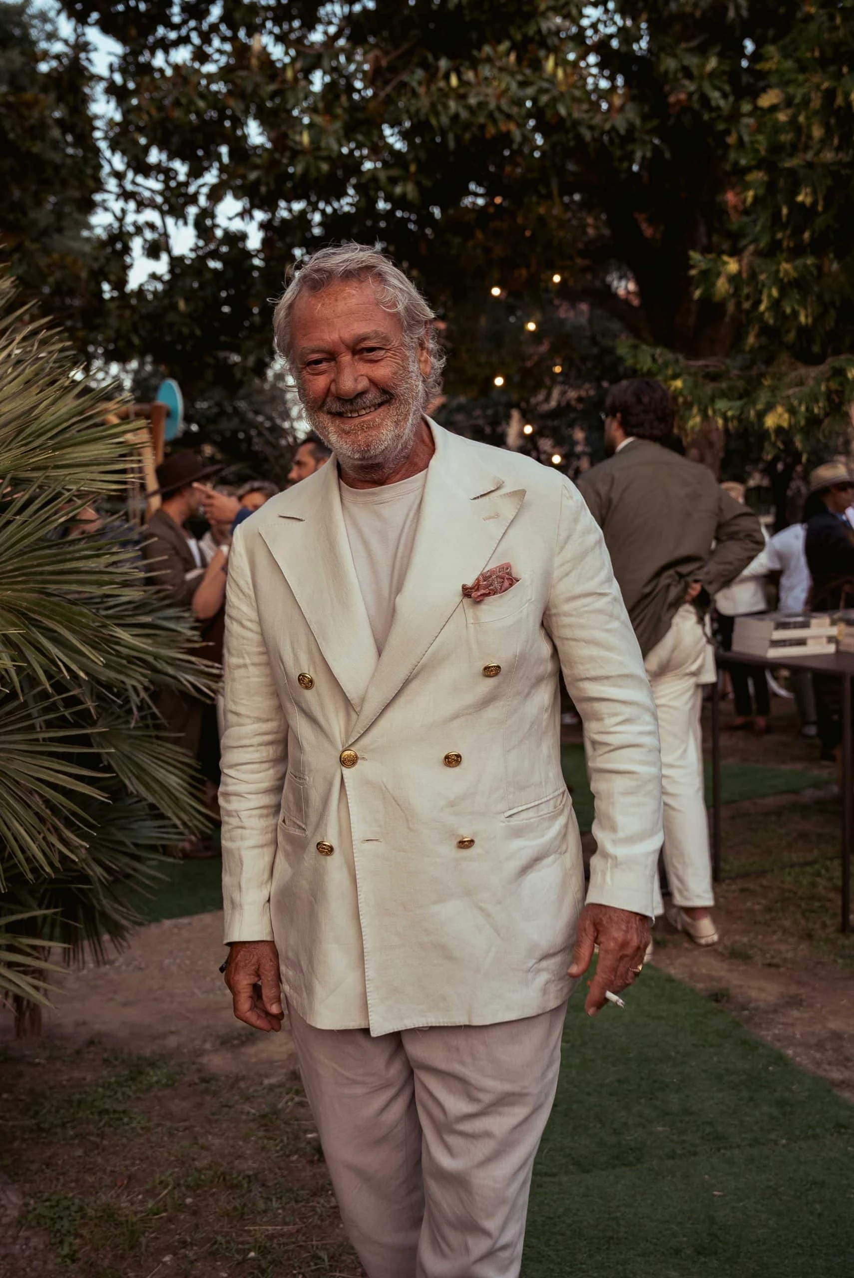 gentlemen at the alexander kraft tailagting party wearing a white double breasted jacket