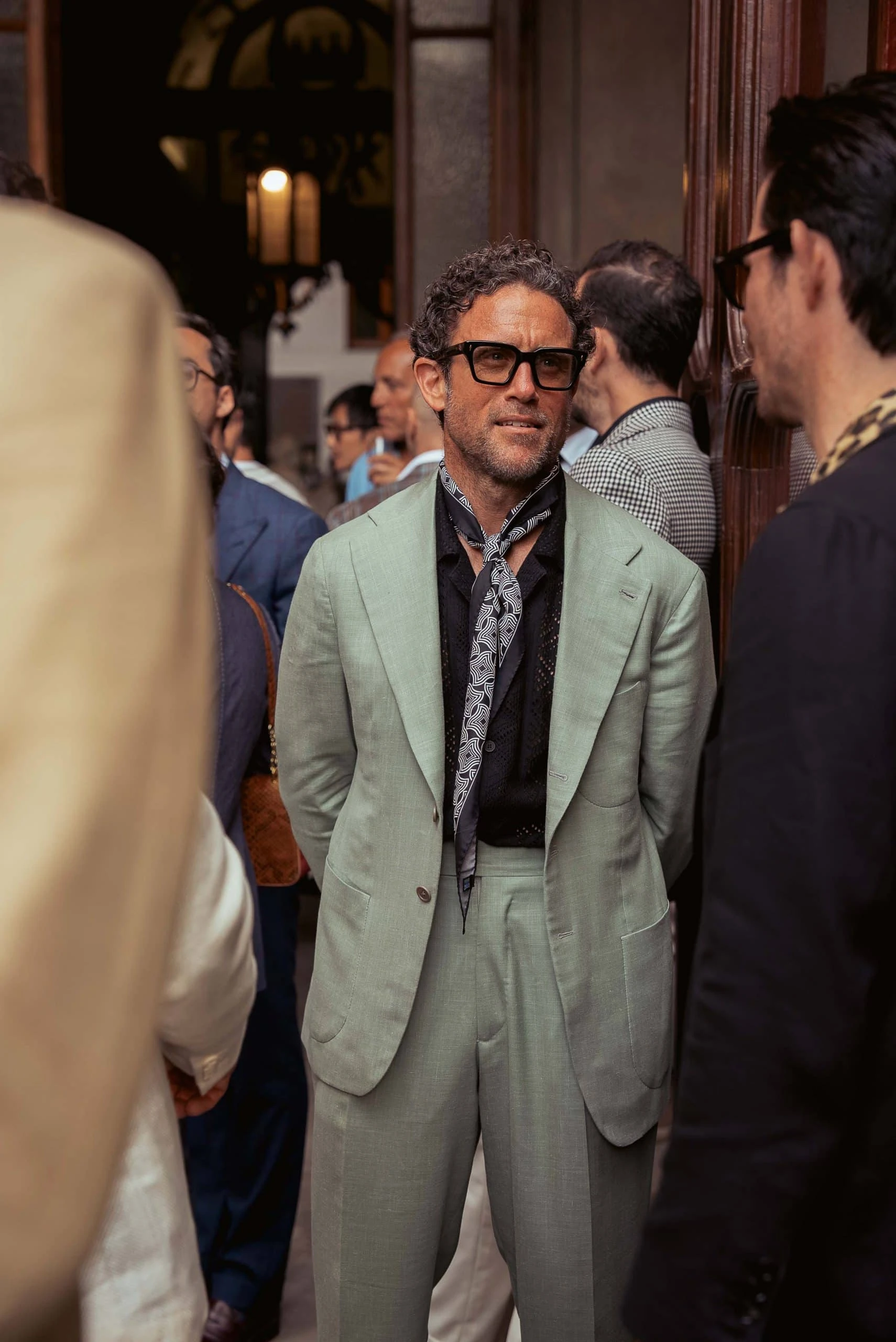 plaza uomo editor urban composition peter zottolo wearing a green suit at the plaza uomo party