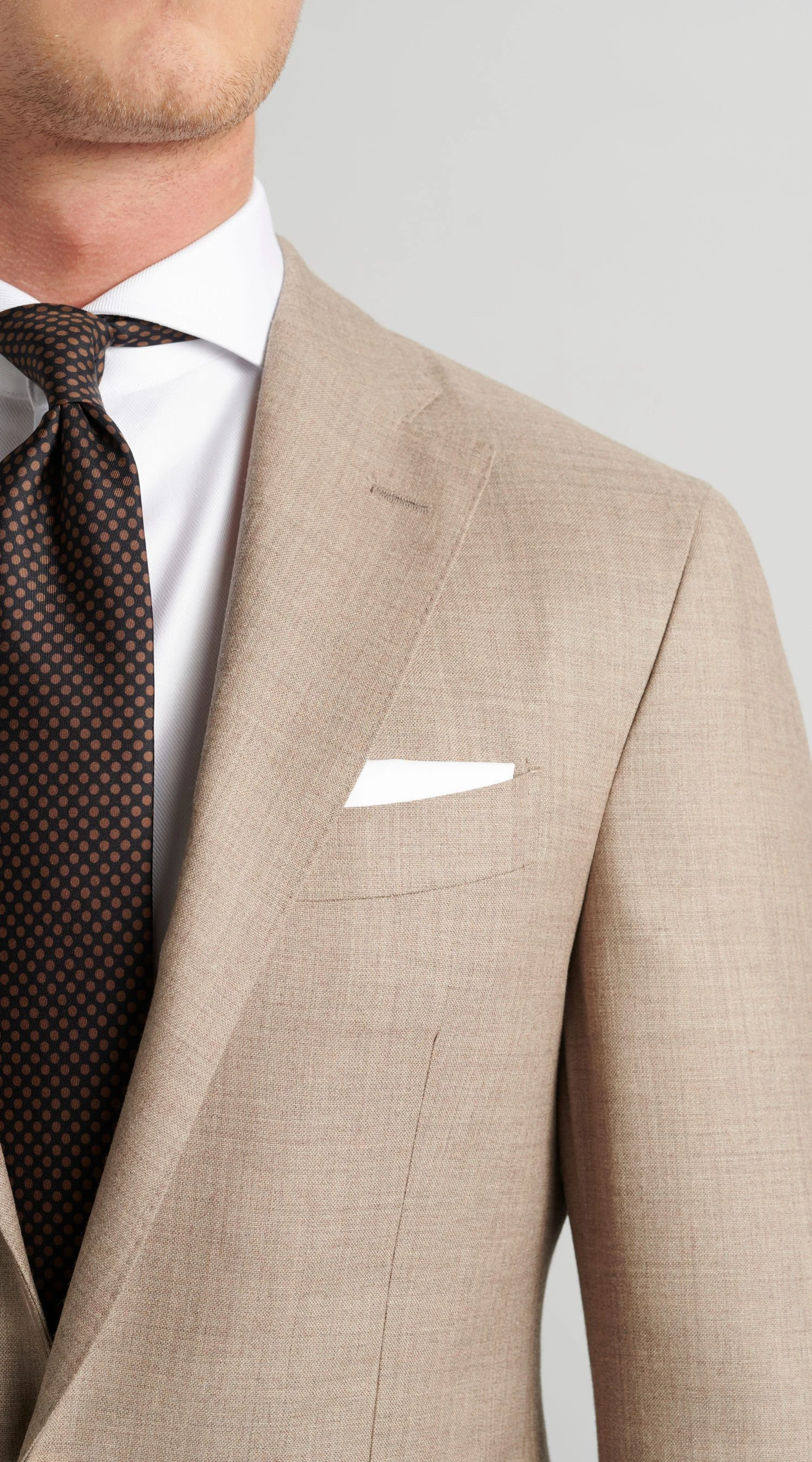 closeup of tan suit in twistair, by Mond