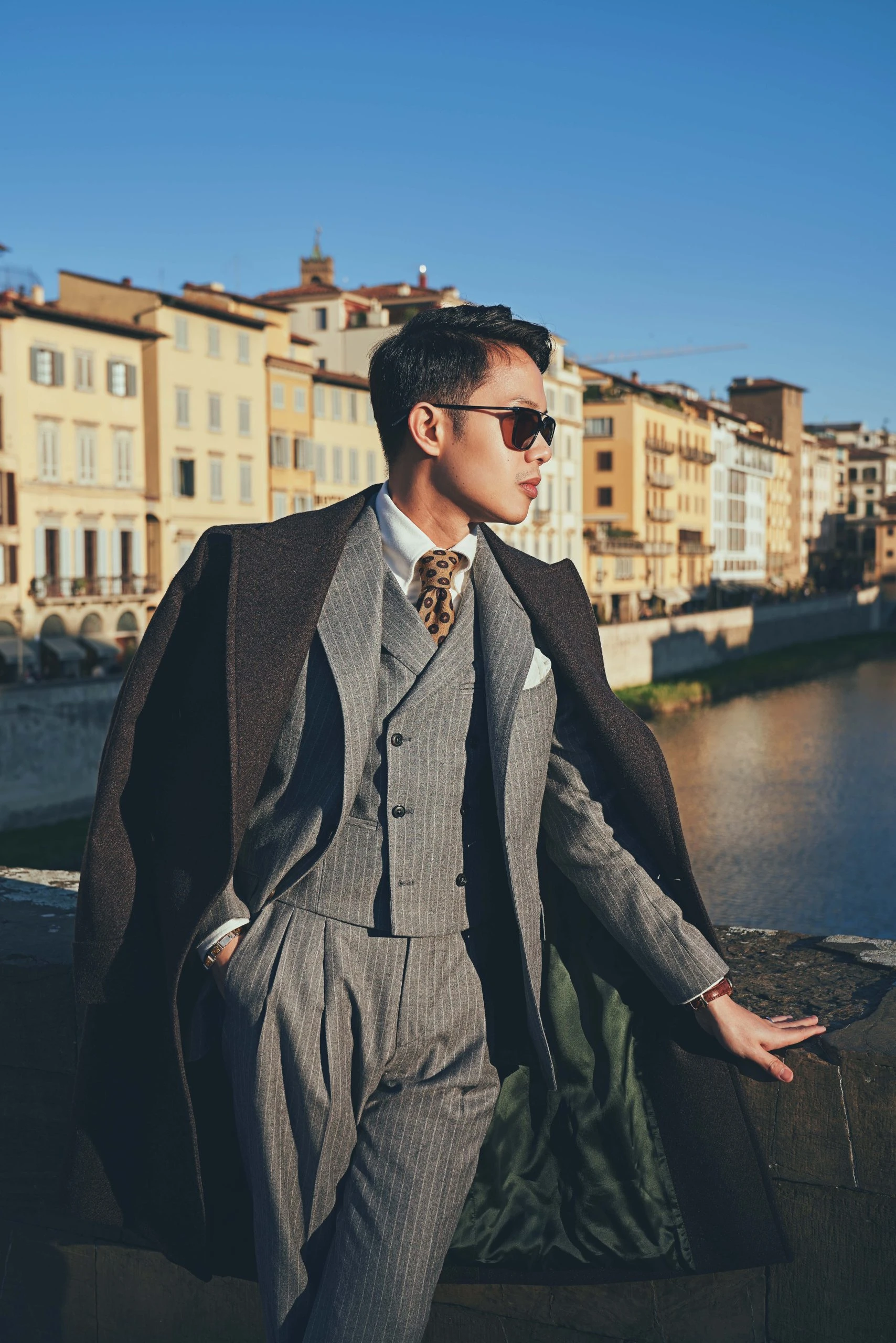 striped grey flannel suit with brown overcoat