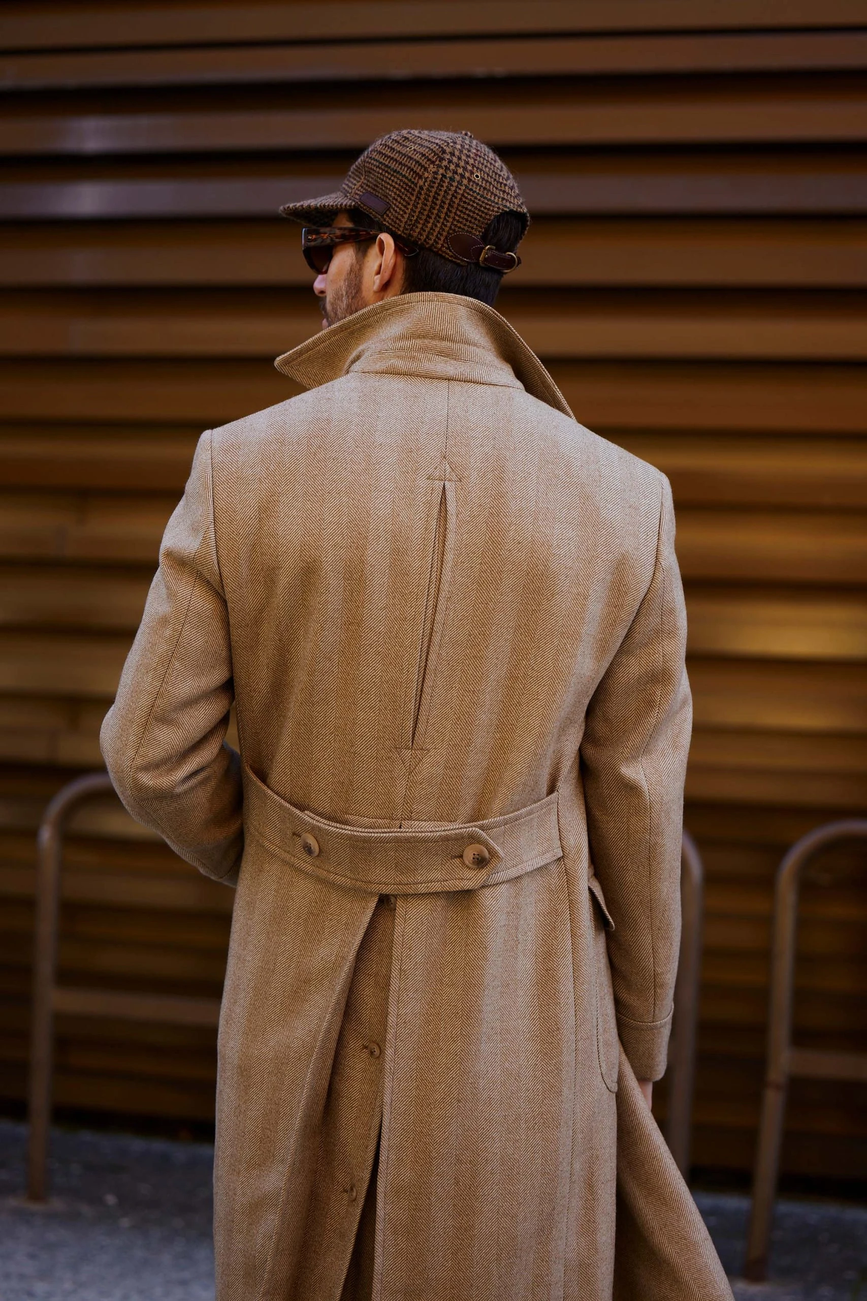 carlos domord at pitti uomo wearing a beige custom made herringbone mond overcoat