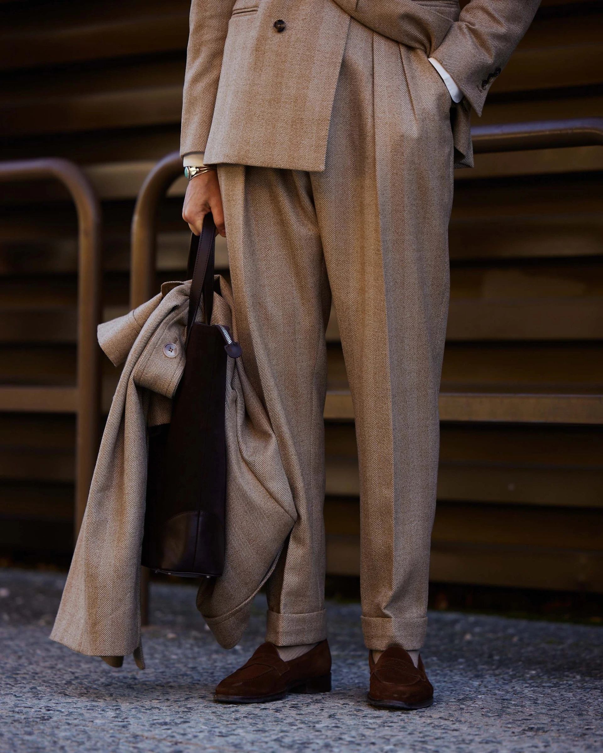carlos domord at pitti uomo wearing a custom made mond herringbone coat and a matching suit